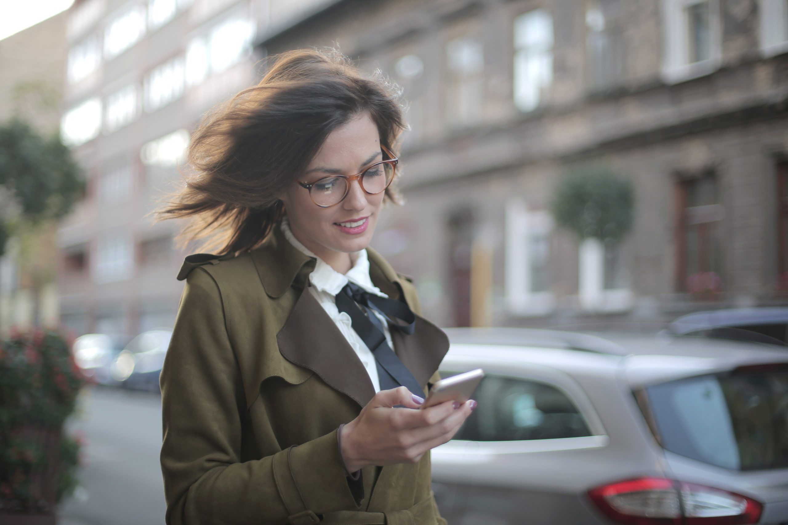 woman texting on the street